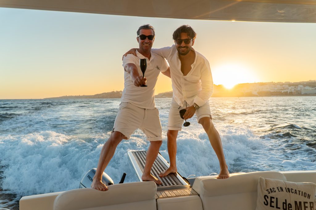 Group celebrating sunset during luxury yacht experience Algarve