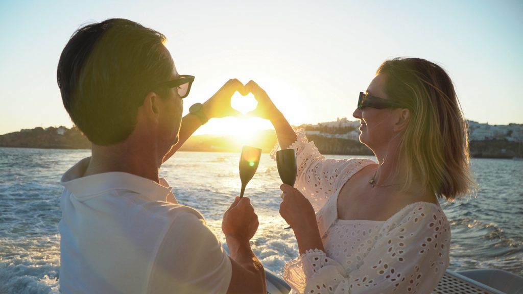Romantic yacht experience Algarve couple enjoying sunset on private yacht